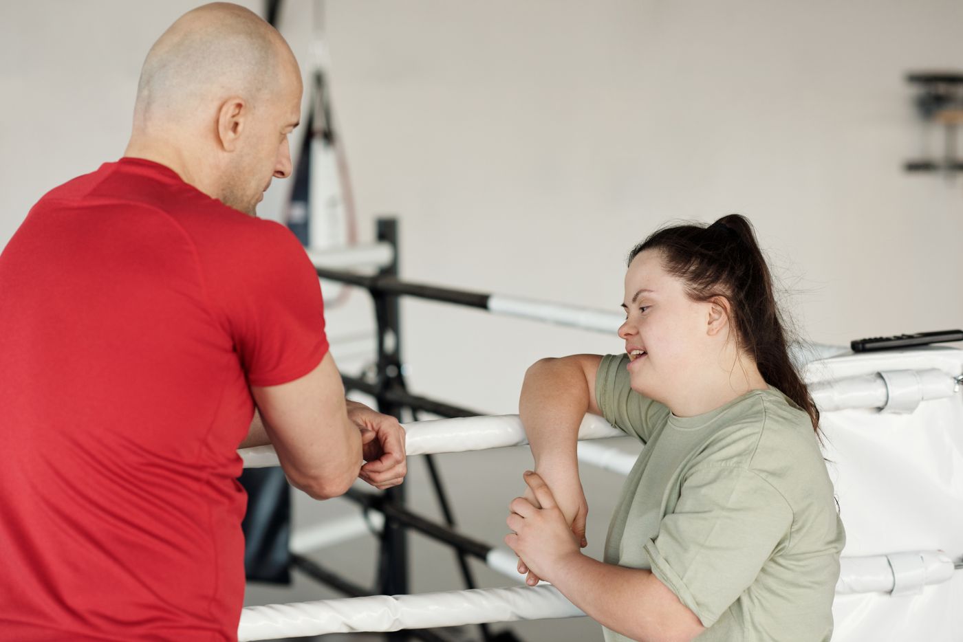 A therapist working with a young woman during a session